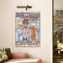 Load image into Gallery viewer, Embroidered cross stitch depicting girl and kitten baking pie