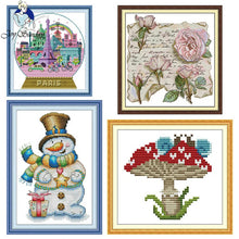 Load image into Gallery viewer, Four cross-stitch patterns featuring a snowman, mushrooms, roses, and a Paris-themed design.