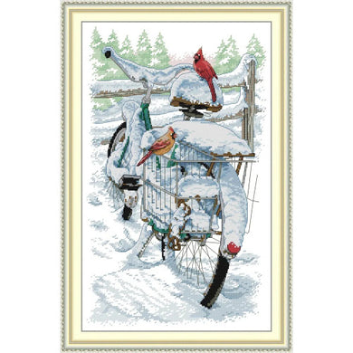 Red bellied bird on bicycle embroidery kit showing whimsical animal design on fabric