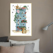Load image into Gallery viewer, Finished gardening still life cross stitch displayed in garden room or shed
