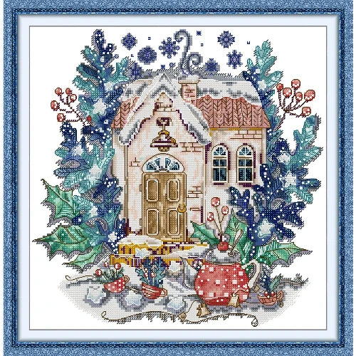 Winter teapot cross stitch kit showing seasonal design with snowflakes on printed canvas