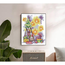 Load image into Gallery viewer, Framed artwork with a colorful design of a ladder, stars, and gift boxes on a wall above a Marshall amplifier.
