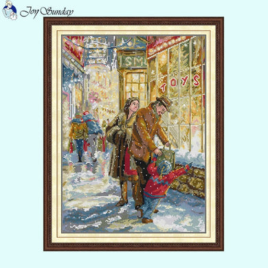 Cozy family Christmas cross stitch scene with fireplace, tree, and stockings on pre-printed fabric.