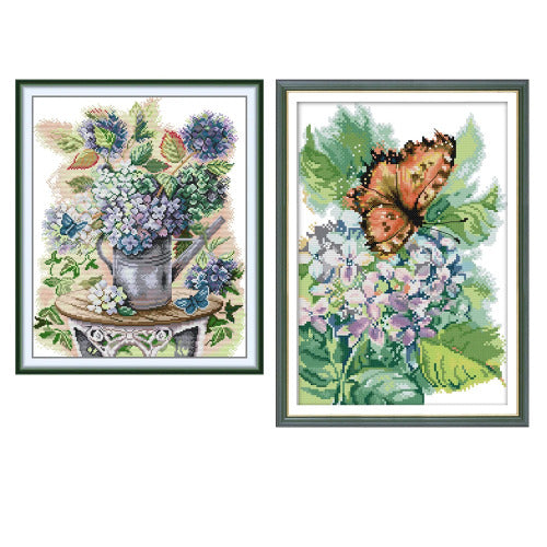Two framed cross-stitch patterns featuring flowers and a butterfly on a white background.