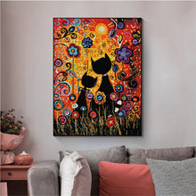 Load image into Gallery viewer, Colorful abstract painting of two cats and flowers on a wall above a sofa.
