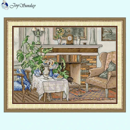 Fireside still life cross stitch pattern with warm colors and rustic decor details.