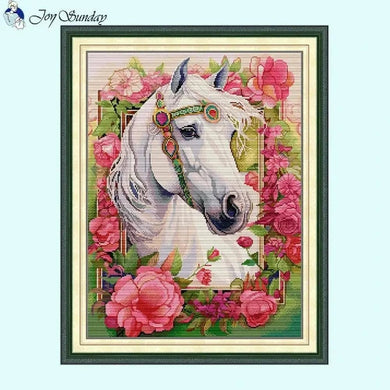 Mystical white horse cross stitch design with celestial patterns on fabric
