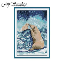 Load image into Gallery viewer, Cross-stitched design of two polar bears on a snowy landscape with &#39;Joy Sunday&#39; branding.
