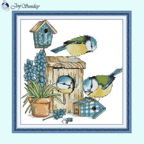 Mockingbird and rustic birdhouse cross stitch design with wildflowers on eco-friendly fabric.