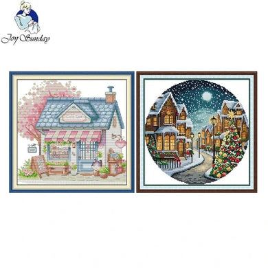 Two framed artworks of a store front and a snowy village scene, with 'Joy Sunday' logo.